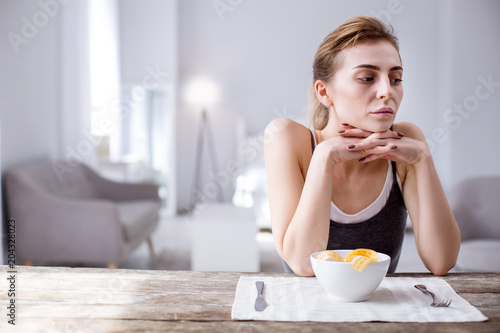 I am fat. Depressed thoughtful woman considering herself fat while thinking about her weight