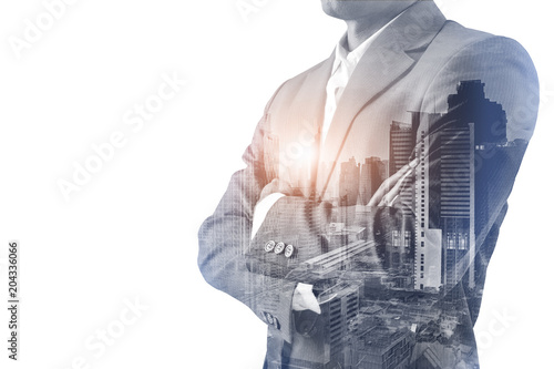 Double exposure of a Businessman wearing suit and a modern city building of Asia Business financial district and commercial in bangkok thailand