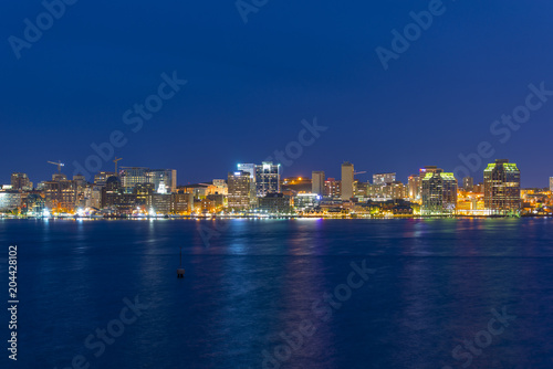 Halifax City skyline at night from Dartmouth waterfront, Nova Scotia, Canada.
