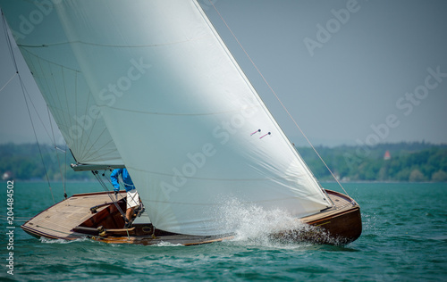 Classic sailing boats racing at a regatta at lake constance