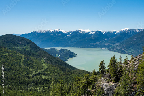 view of Howe Sound and far away snow covered mountains on top of Stawamus Chief