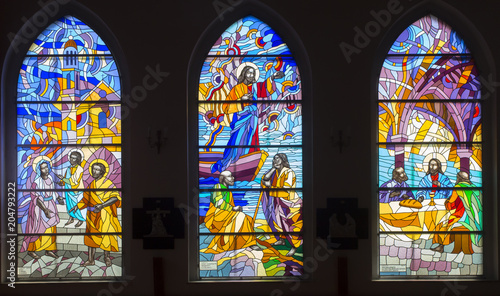 Ozarowice, Poland, 22 April 2018: Colorful stained glass windows in the windows of the church in Ozarowicach in Silesia