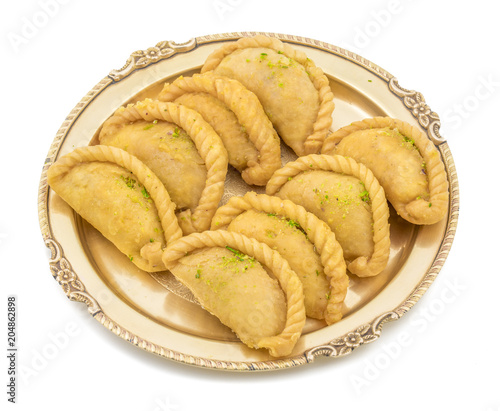 Gujiya or Gujia is a indian sweet dumpling made with suji, Maida or wheat flour and stuffed with khoya. It is common in North India, particularly in Bihar, Uttar Pradesh, Madhya Pradesh or Rajasthan