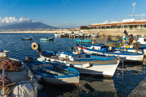 Fishermen boats in the port of Castellammare di Stabia near Naples, on background Vesuvius volcano
