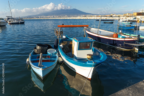 Castellammare di Stabia, Naples, Italy - fishermen boats in the port, on background Vesuvius