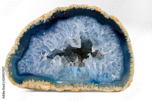 Geode with crystals of light-blue color. Cross section of natural stone.