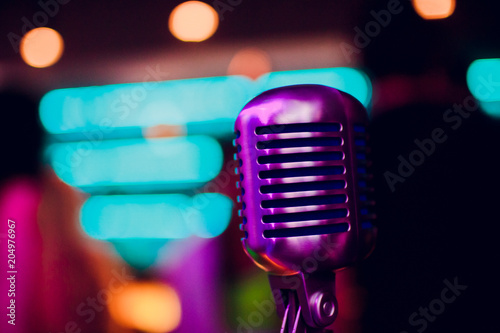 microphone on stand up comedy stage with reflectors ray, high contrast image