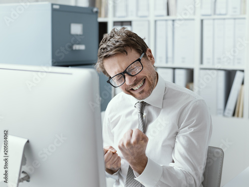 Cheerful businessman celebrating his success