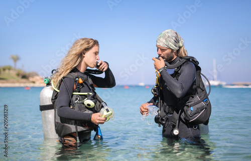 Scuba divers checking the air oxygen tank