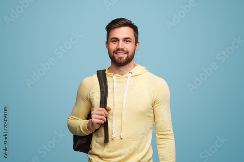 Handsome successful student on blue