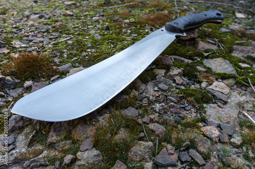 Large working knife. Photo of a machete at an angle.