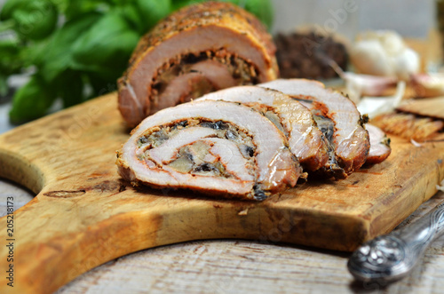 Pork roulade on wooden board