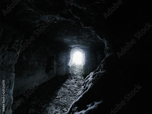ansient dark stone cave whith letters inside view