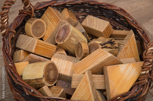 Montessori Waldorf building blocks made of wood in a basket