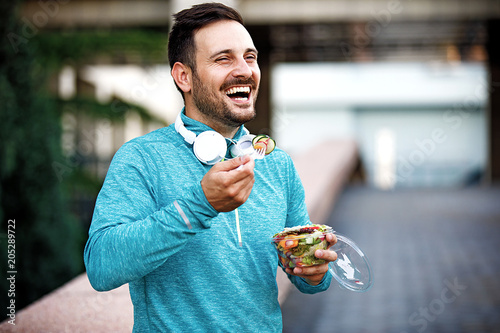 Man is eating vegetable salad