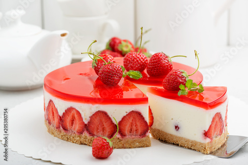 Cold cheesecake with strawberry and strawberry jelly.