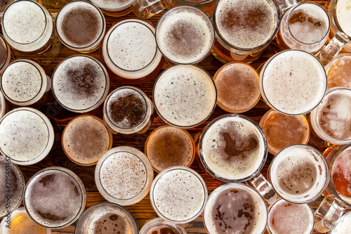 A variety of full, frothy lager glasses and sizes