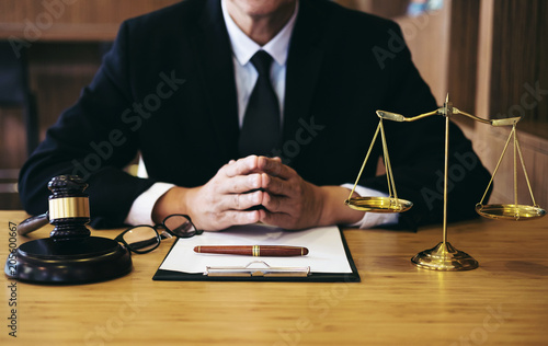 Judge gavel with Justice lawyers, Businessman in suit or lawyer working on a documents. Legal law, advice and justice concept