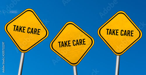 take care - yellow sign with blue sky