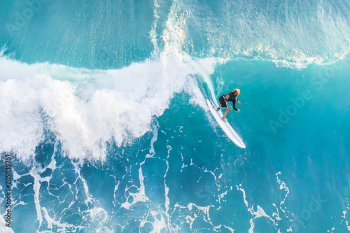 Surfer on the crest of the wave, top view