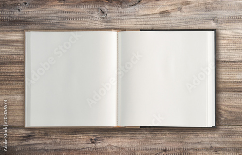 Open book wooden background Minimal flat lay