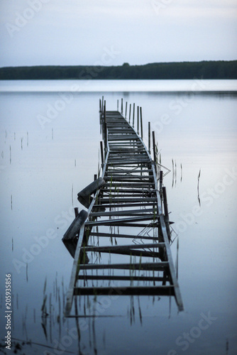 Old wooden jetty on the lake. Old wooden jetty on the lake.