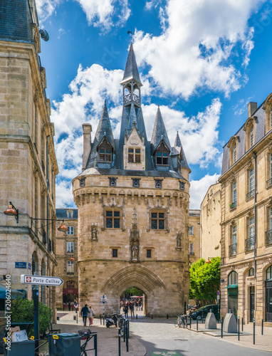 Bordeaux, France, 8 may 2018 - tourists passing the Porte Cailhau at a entrance of the city seen from the water side