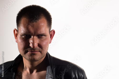 Portrait of a man on a light background.