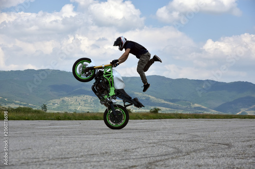 Stunt motorcyclist in action
