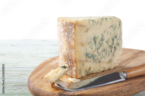 Wedge of Stilton Cheese on a Cheeseboard