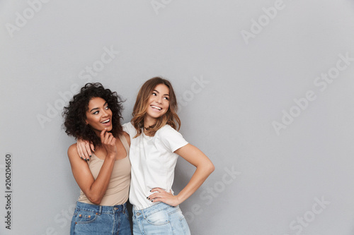 Portrait of two happy young women standing