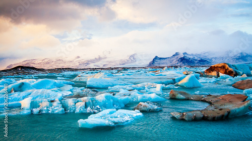 Icebergs drifting to sea in Jokulsarlon during winter.. Iceland