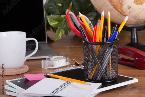 Assortment of Office Supplies on a Desktop