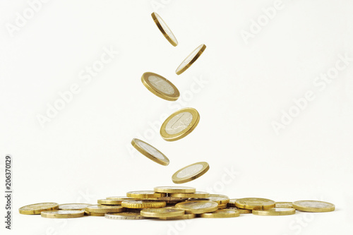 Falling euro coins on white background