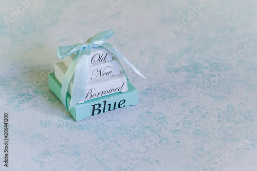 Blue wedding background. Wedding tradition : something old, new, borrowed and blue. Sky blue background with copy space for text. Blank stationary template / invitation mockup.