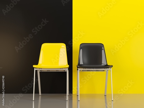 Two chairs in front of black and yellow wal