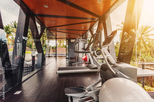 Small gym in Luxury villa, big windows, tropical view