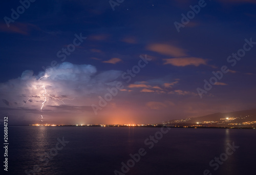 Lightning over the city of Le Port in Reunion Island