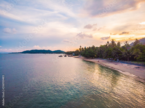 Aerial view of beautiful tropical beach and sea with palm and other tree in koh samui island