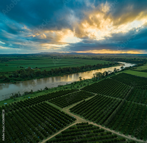 Wallaville, Queensland / Australia - April 2018 - Aerial Photo over a Citrus Farm and the Burnett River at Sunset