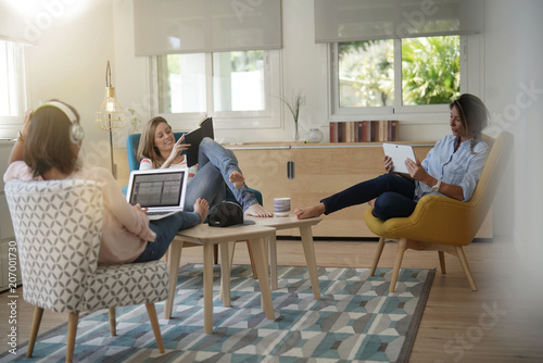 Roommates talking together in living-room