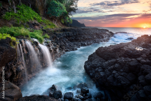 Waterfall at Queen's Bath during sunset, Kauai, Hawaii
