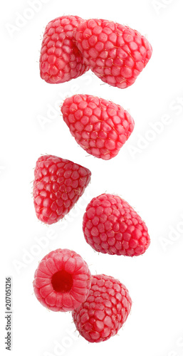 Falling raspberry fruits isolated on white background with clipping path