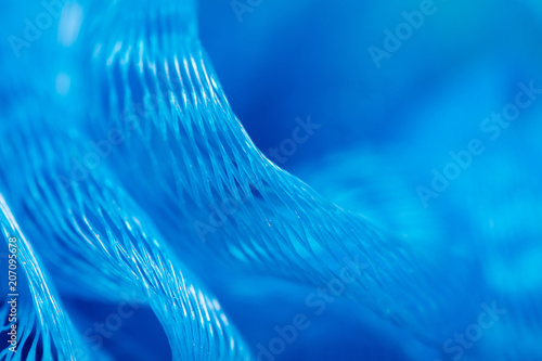 Blue synthetic sponge as an abstract background