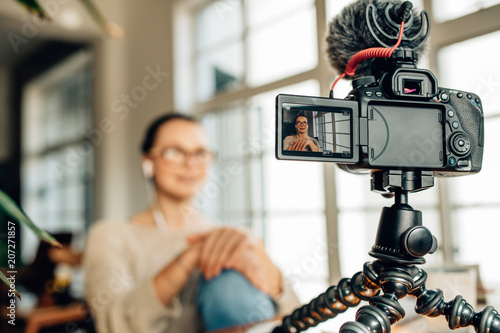 Woman blogger recording her content on camera