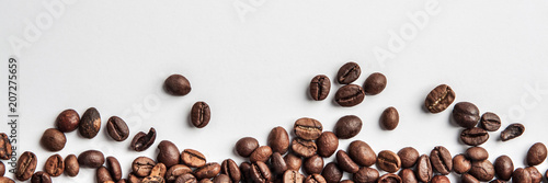 Panorama with coffee scattered on a white background