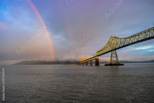 Rainbow over river and bridge in Astoria, Oregon