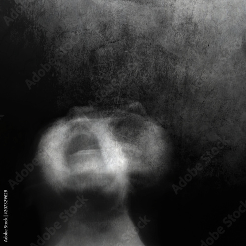 Scream of horror. Screaming woman face. Shot with long exposure.