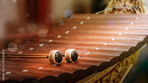 close up of alto xylophone traditional classical Thai and sountheast asia musical instrument made of wood making sound by hit sticks to wood rail