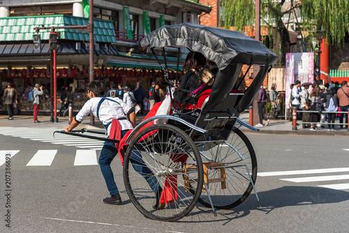 TOKYO, JAPAN - OCTOBER 31, 2017: Rickshaw on the city street. Copy space for text.